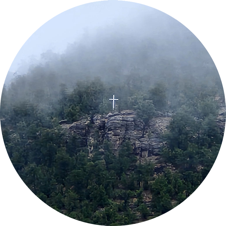A foggy hillside with Cross in Pecos, New Mexico
